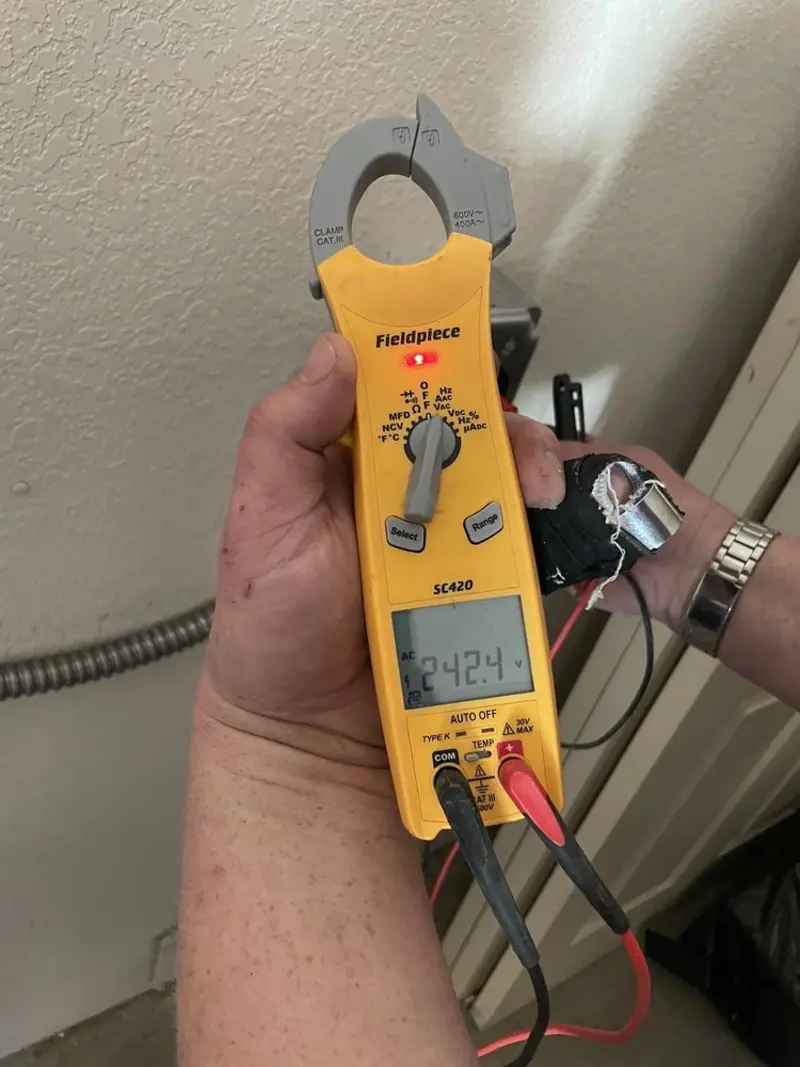 Voltage testing with clamp meter during Ceiling Fan Installation in Washingtonville